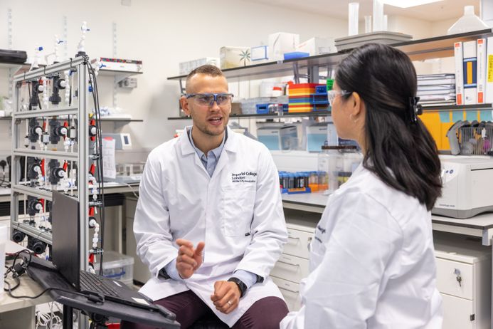 Two researchers having a discussion