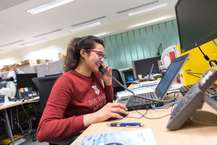 student on a telephone in an office