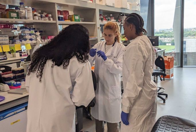 Image of students looking at vials