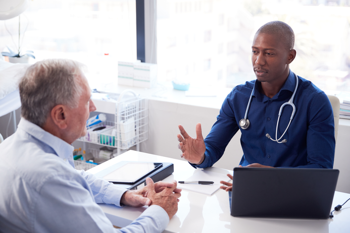 A doctor speaking with a patient