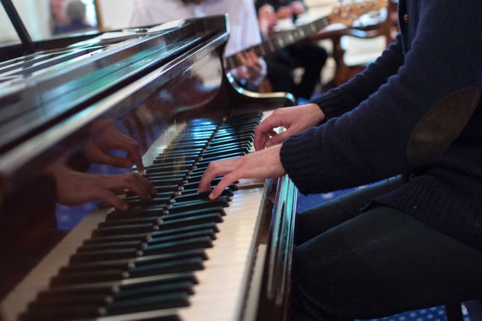 closeup hands playing piano