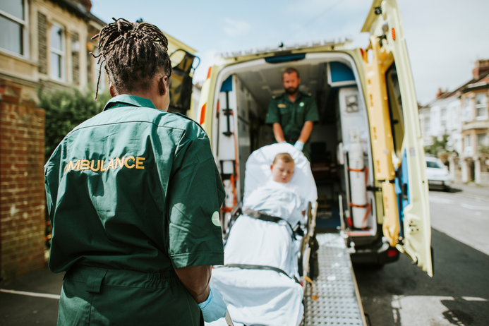 Patient being carried inside an ambulance