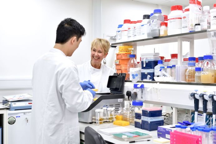 Professor Jane Davies in laboratory discussing with researcher