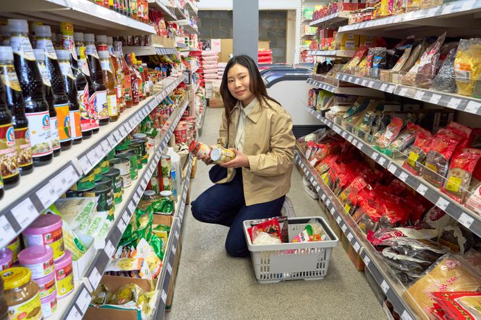 Student choosing food in a Thai supermarket