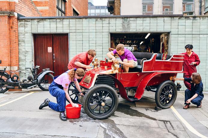 Team Bo cleaning the vintage car