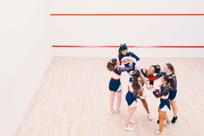 A group of cheerleaders in a gym