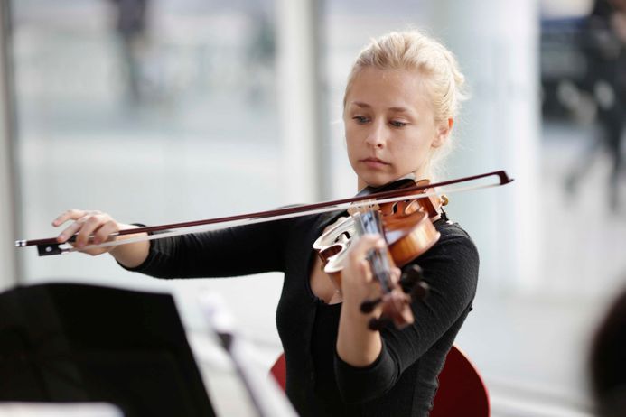 Student playing an instrument