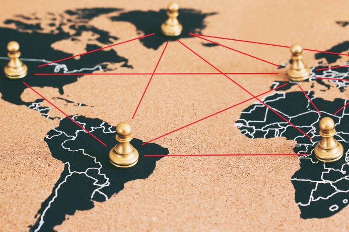 concept of geopolitics or worldwide economy. chess figures placed on map banner