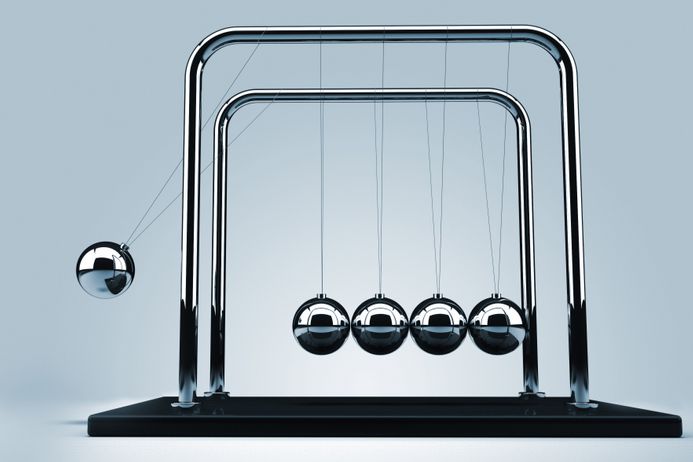 a newtons cradle being started