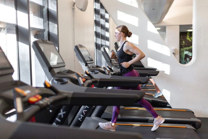 A student on a treadmill in a gym