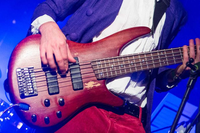 closeup of electric guitar being played