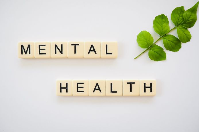 Letter tiles spelling out mental health