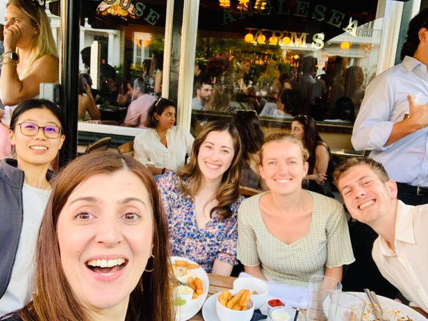 People sitting around a table celebrating