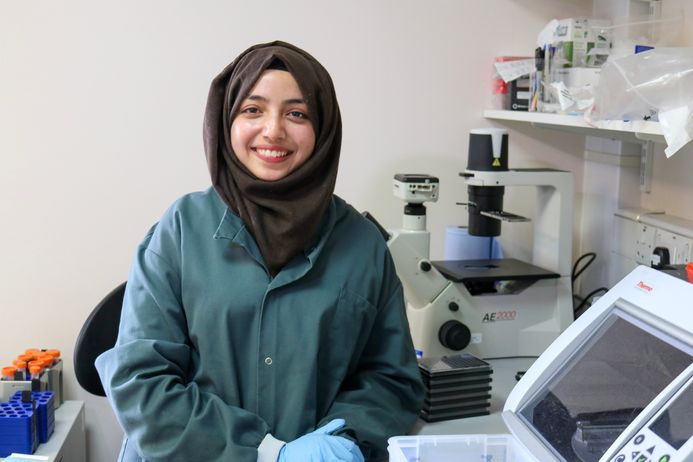 female student posing in labratory