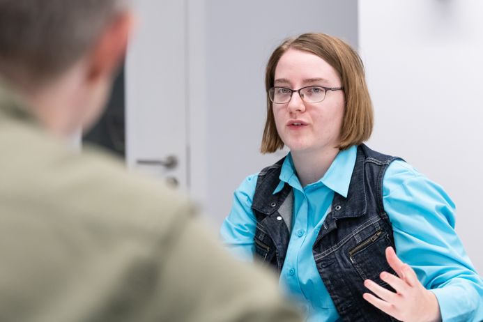 A student and a teacher having a one-to-one discussion