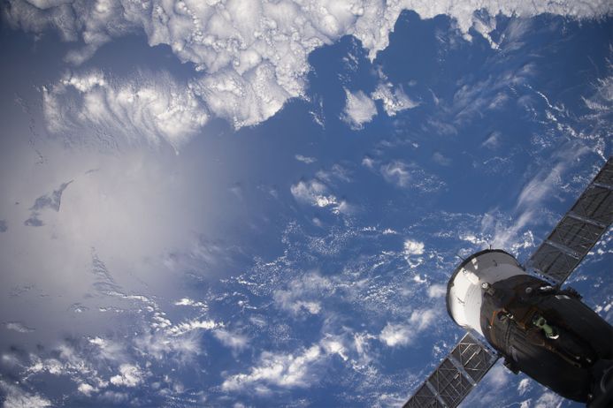 Earth viewed from the International Space Station with part of the space station visible