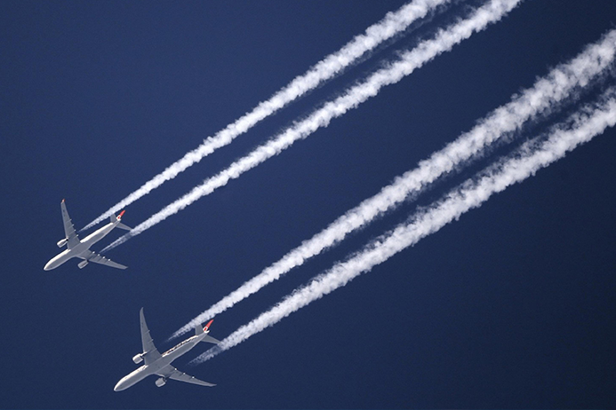 Contrails from two aeroplanes in the sky