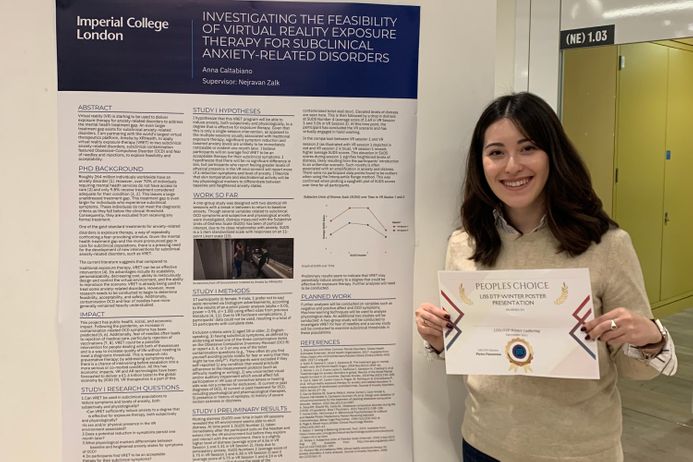 Student receiving poster award