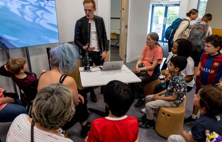 researcher showing his invention at the Invention Rooms 