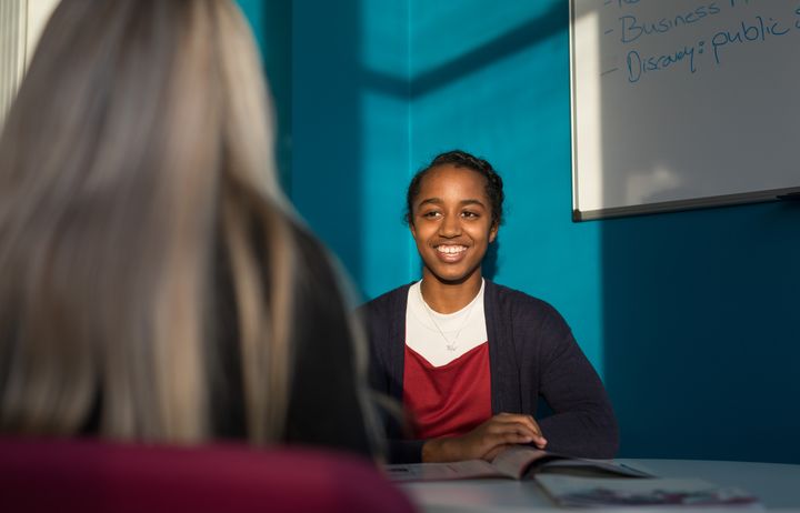 A student smiling.