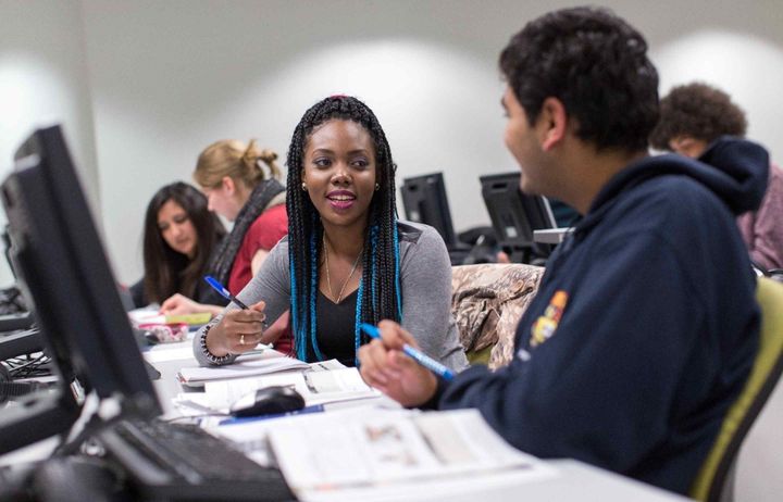 Students learning in a computer lab