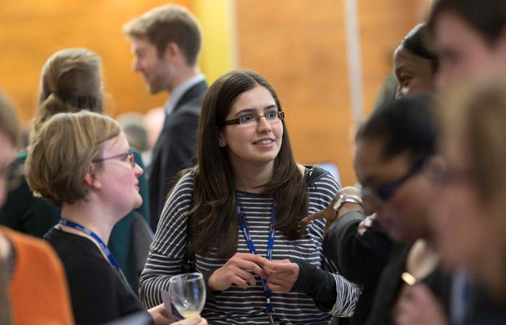 Example of an event with people mingling in an events space