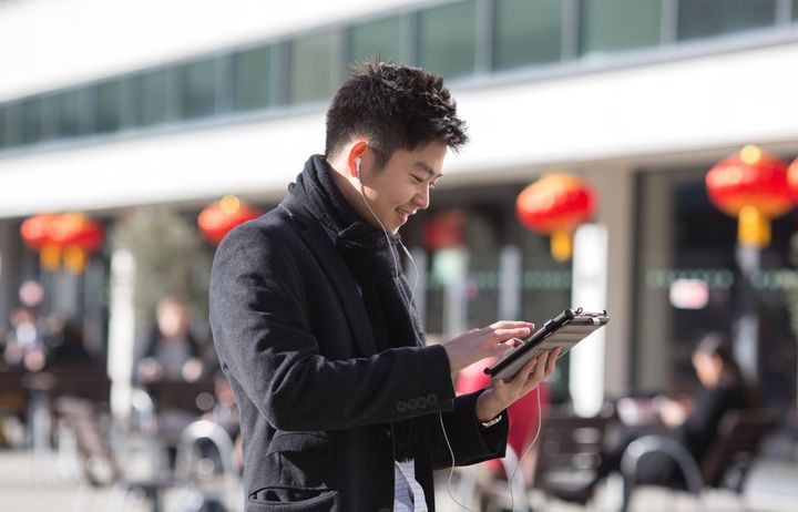 Student on campus on an ipad