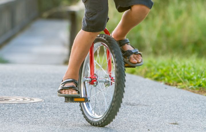 A man on a unicycle