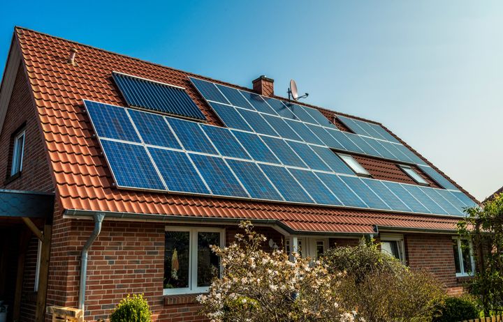 Solar panels on the roof of a suburban house