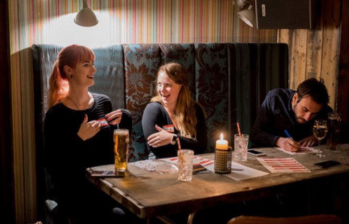 Friends playing a pub quiz