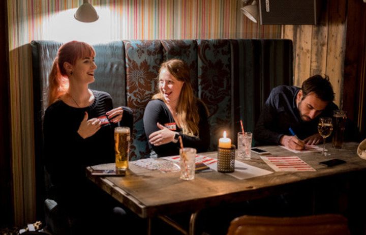 Friends playing a pub quiz