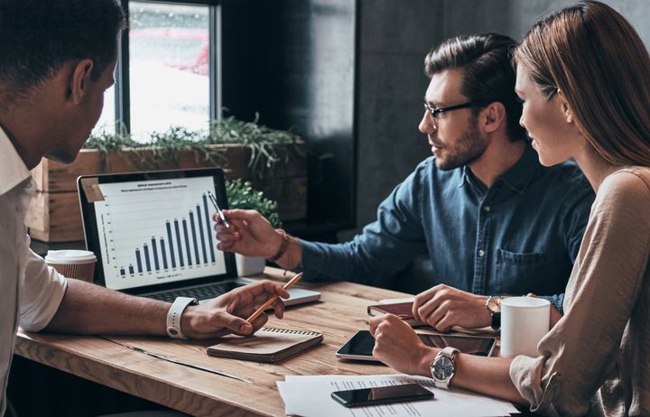 Three people in a work meeting