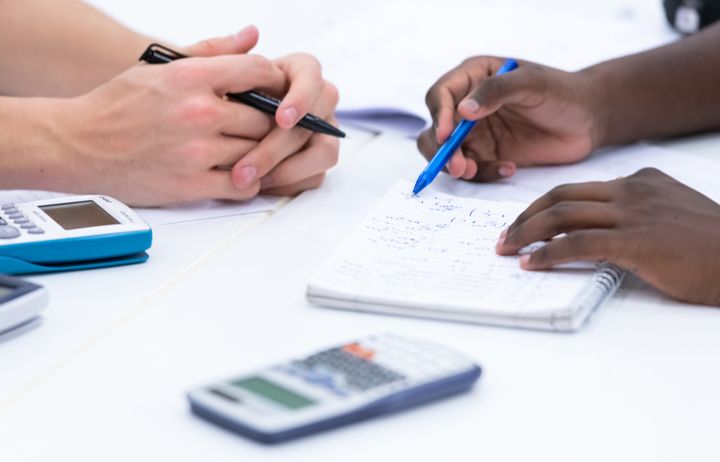 hands and notebooks 