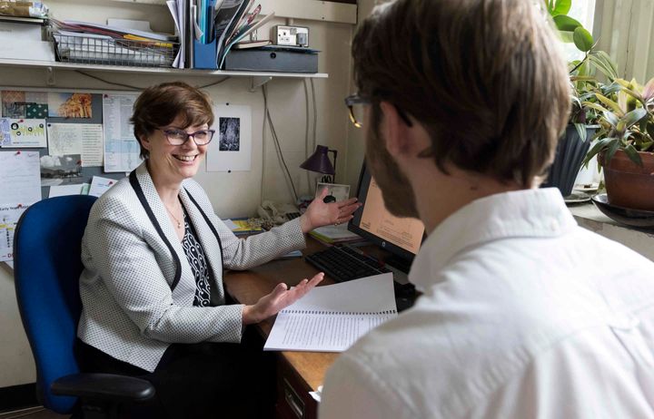 supervisor talks to student