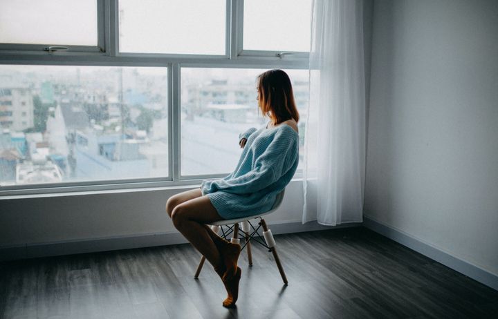 Woman staring out a window