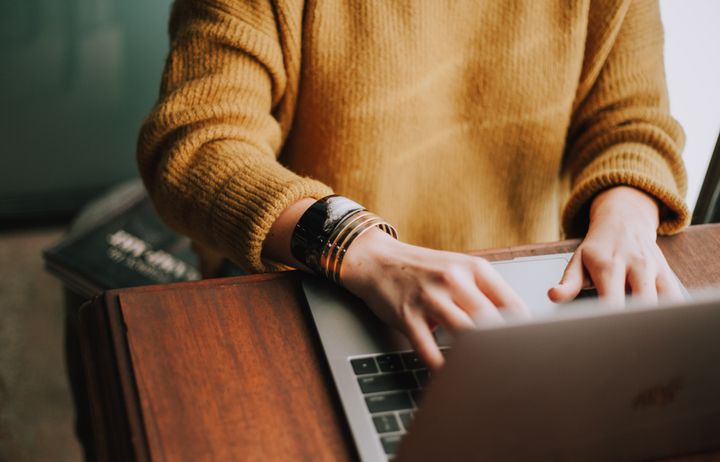 woman typing on laptop