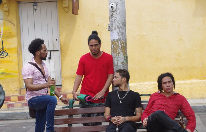 Young adults sitting on a bench