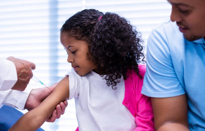 Child receiving an injection