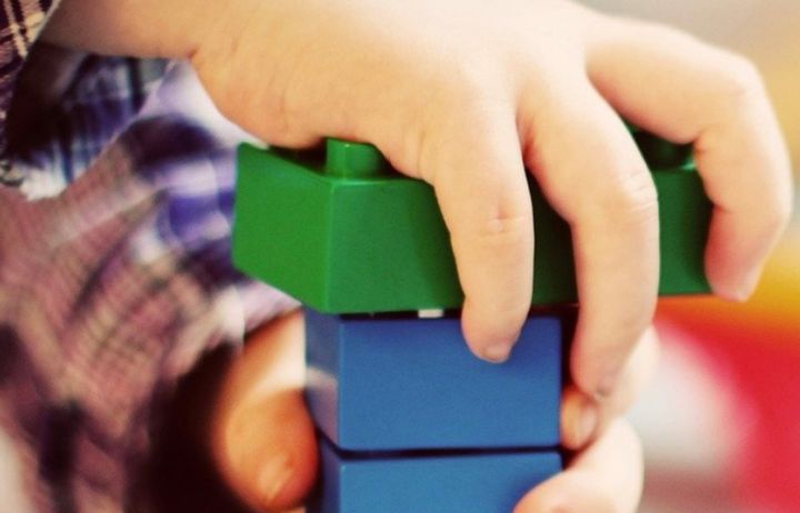 child with toy bricks