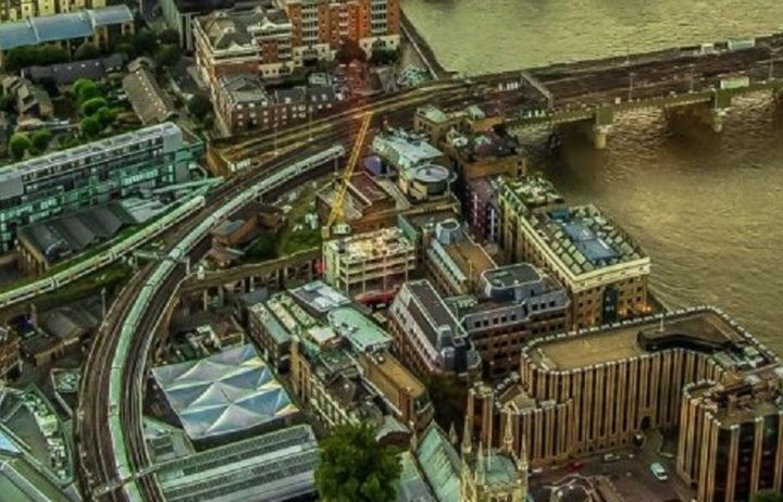 View of a train line through the city and over a bridge