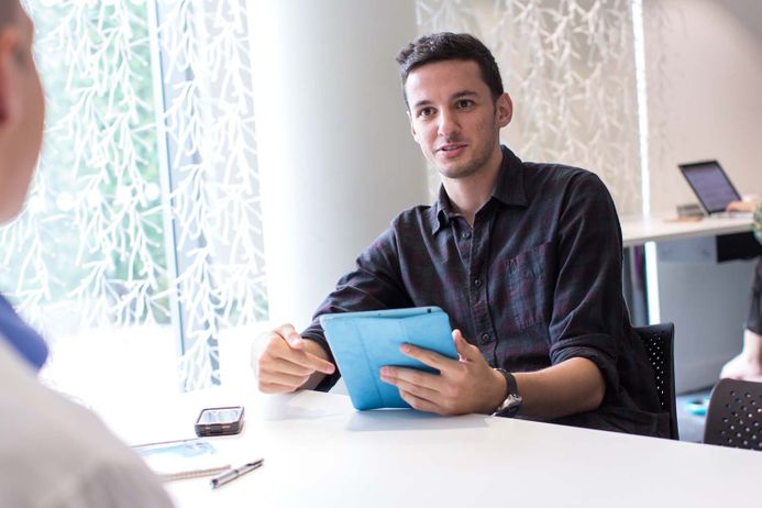 Student sitting at table reading