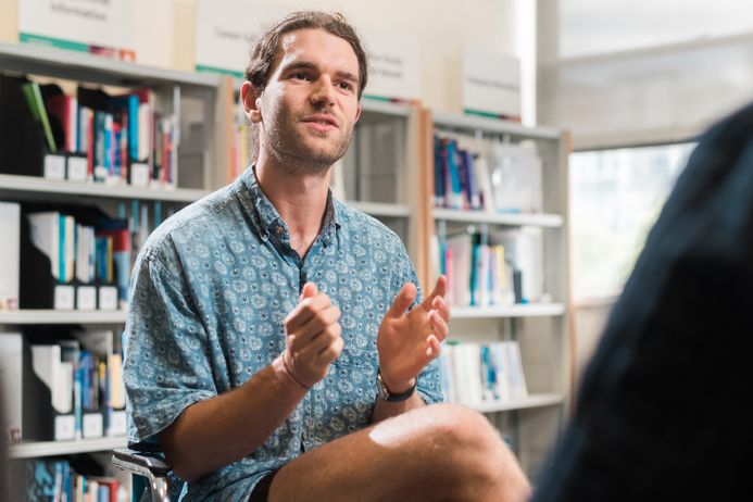 Man talking in library