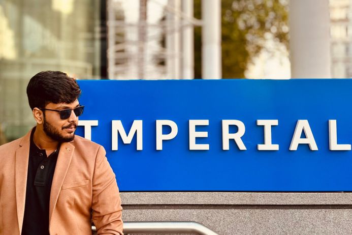 A student in front of imperial sign