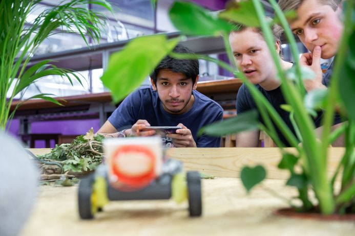 Electrical and electronic engineering students collaborating on a remote controlled design