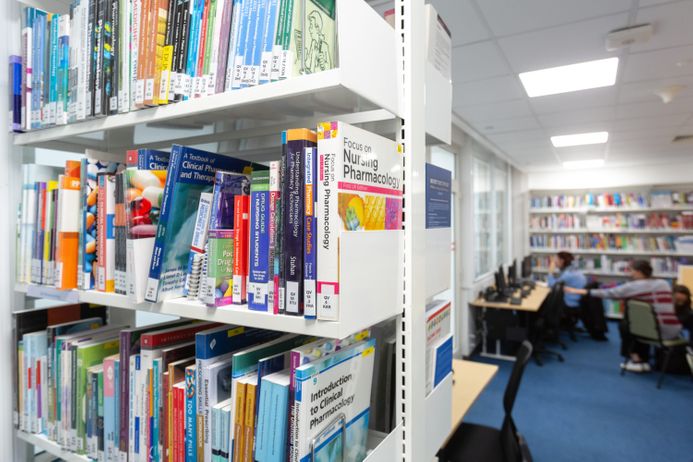 A photo of books in a library