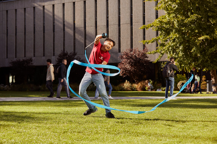 Zhengli dances with a ribbon on the Dangoor Plaza