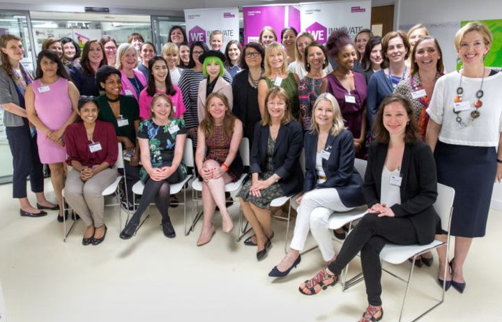 A group of women gathered together for a group photo at We innovate conference at Imperial College