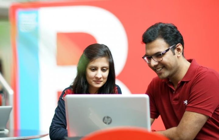 2 people on a laptop