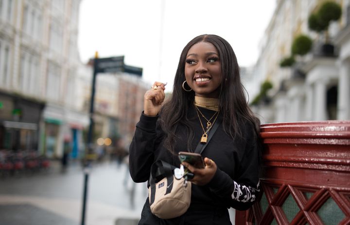 A student smiling at the camera.