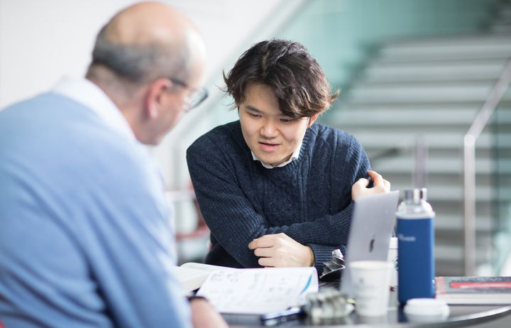A student speaking to a tutor.